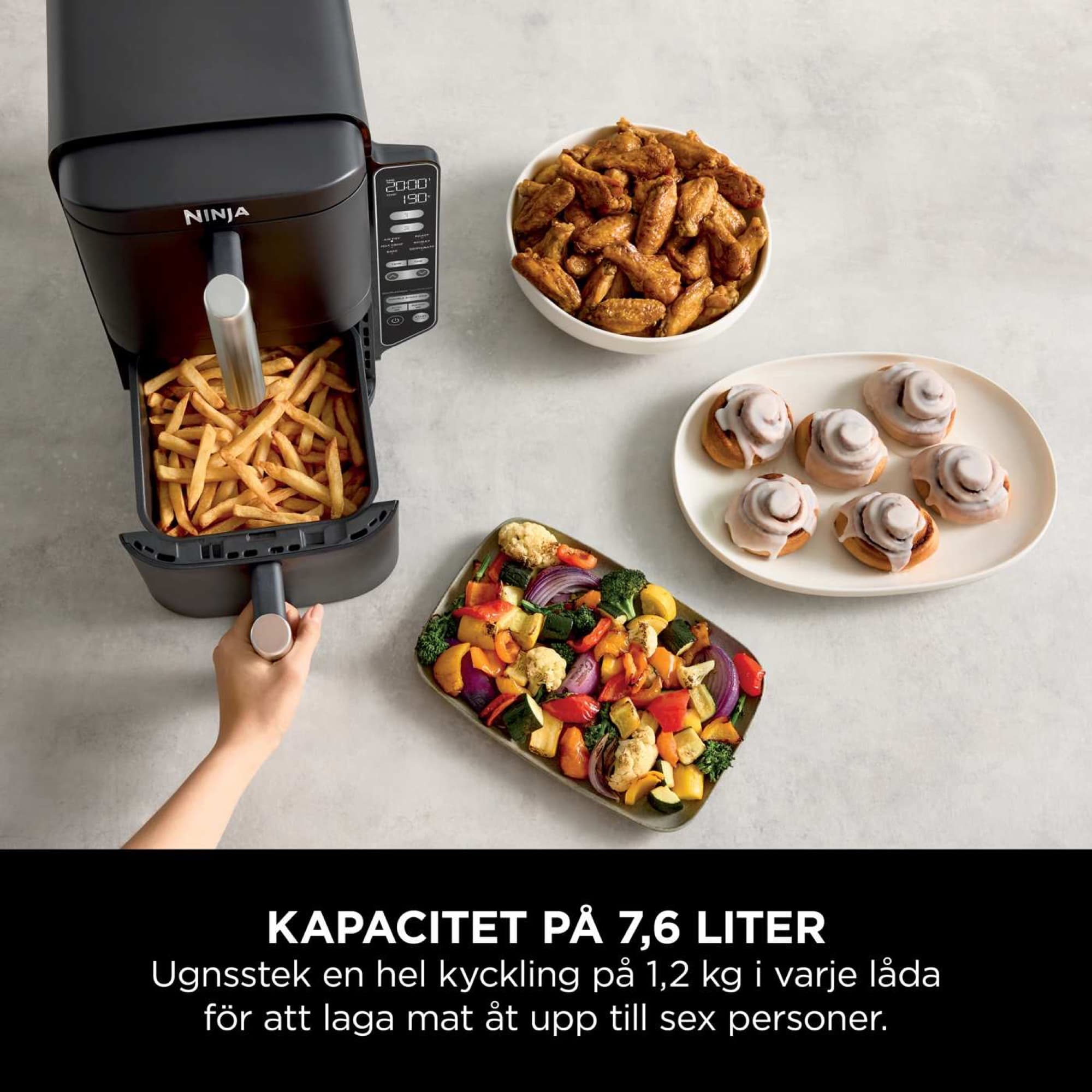 Pommes i den övre lådan, grönsaker och bullar bredvid