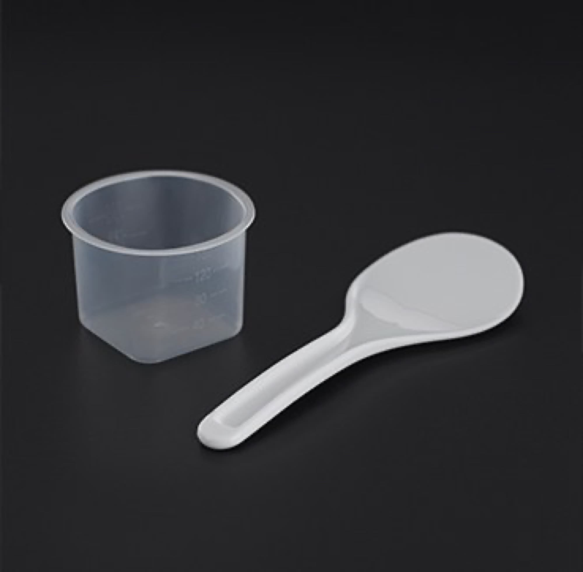 Measuring cup and rice spoon
