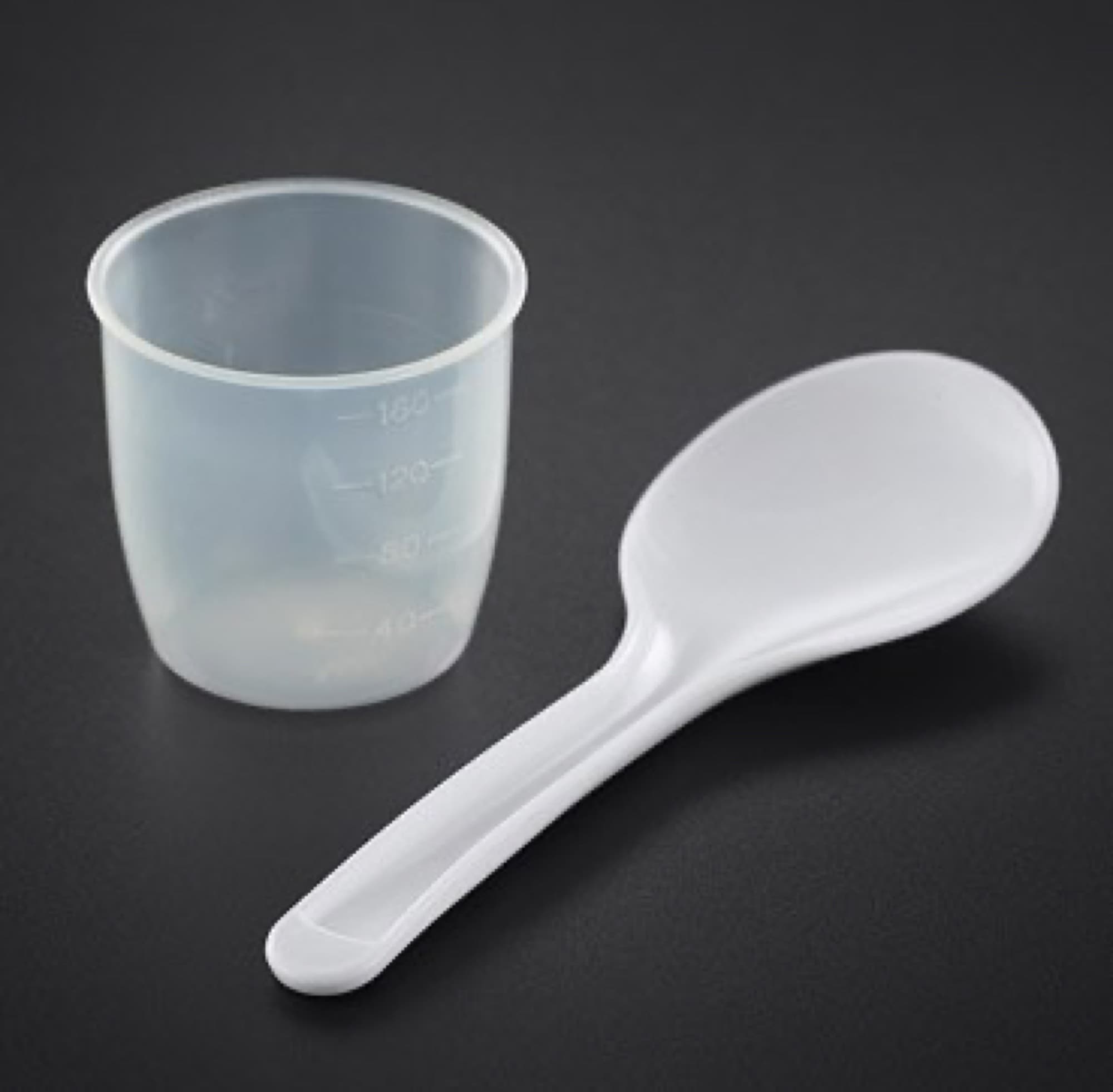 Measuring cup and rice spoon