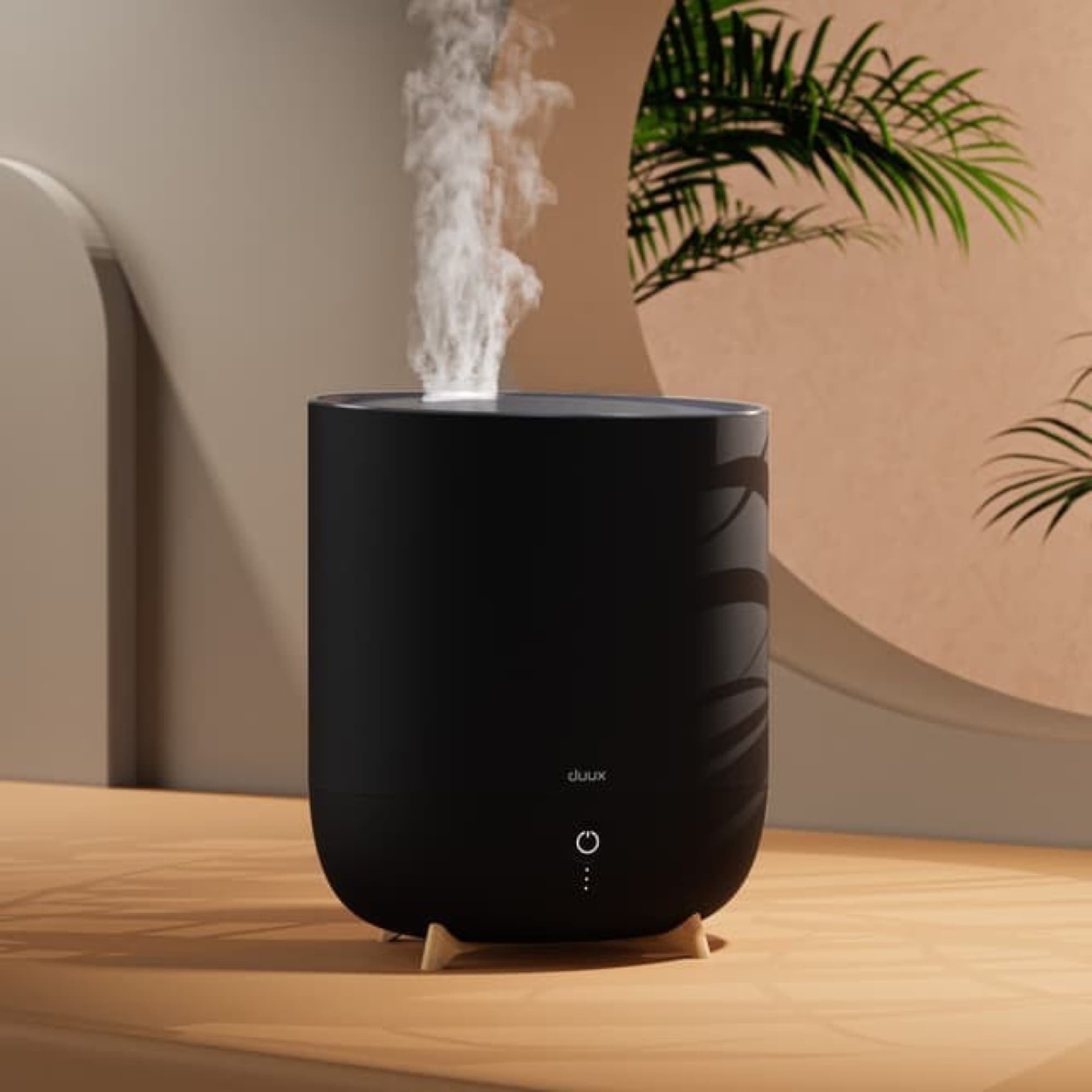 Duux Neo with mist in a living room