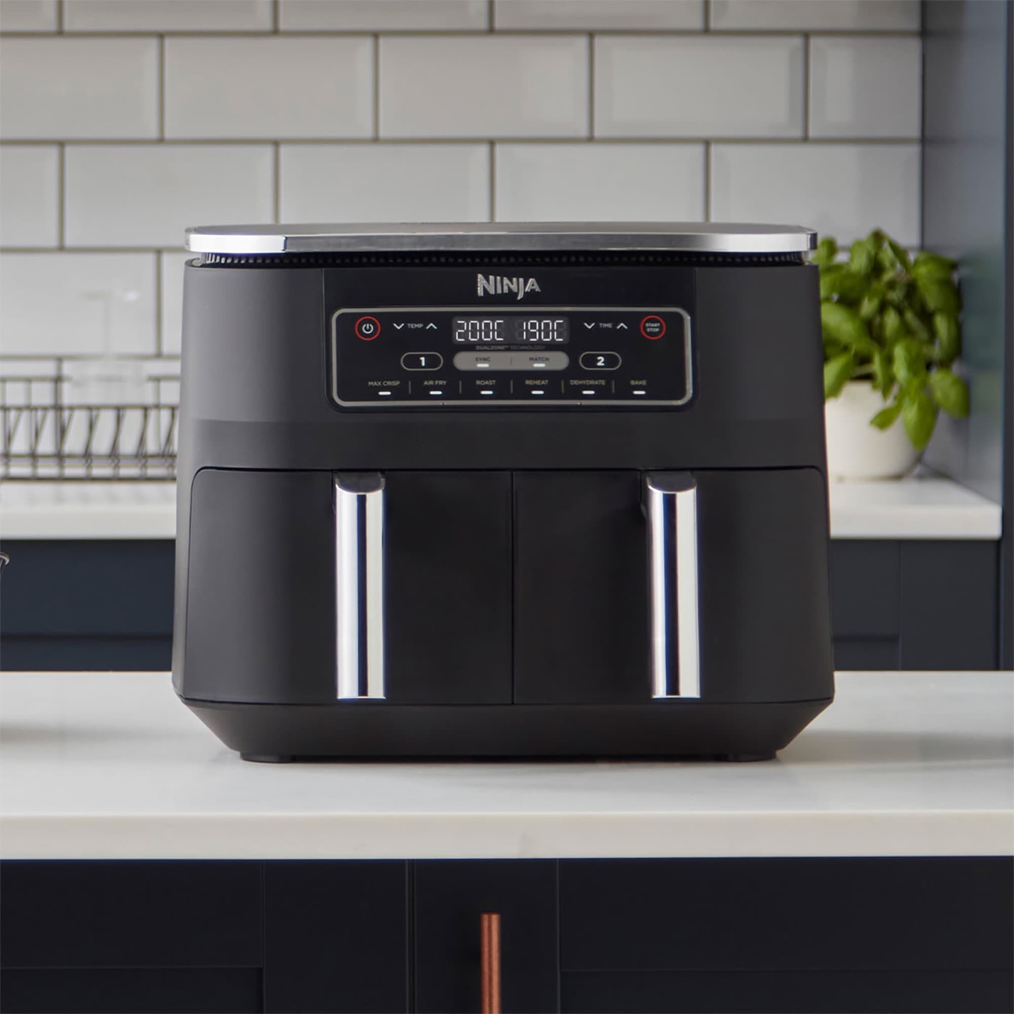 The air fryer on the worktop showing two temperatures