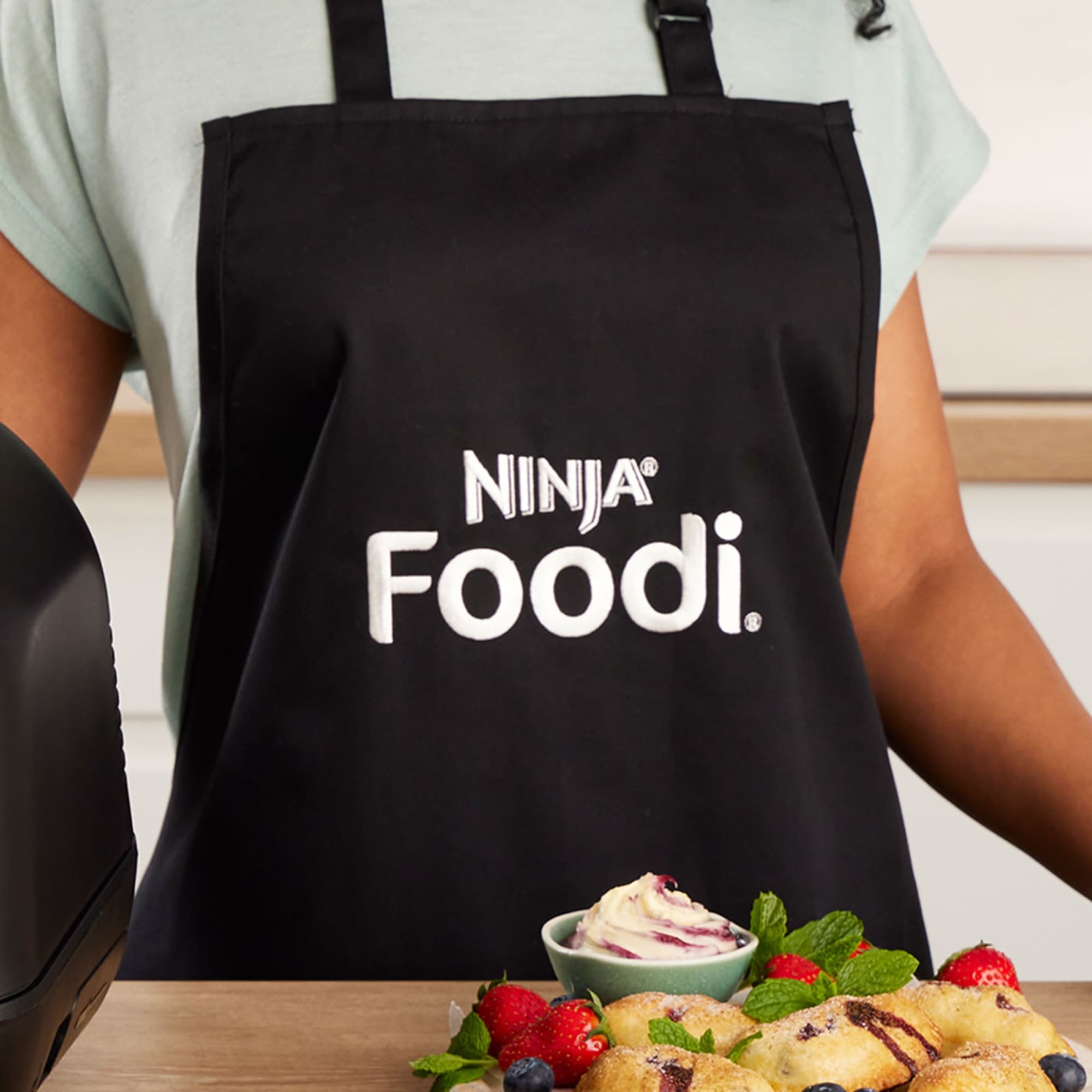 Close-up of the apron with the Ninja Foodi logo