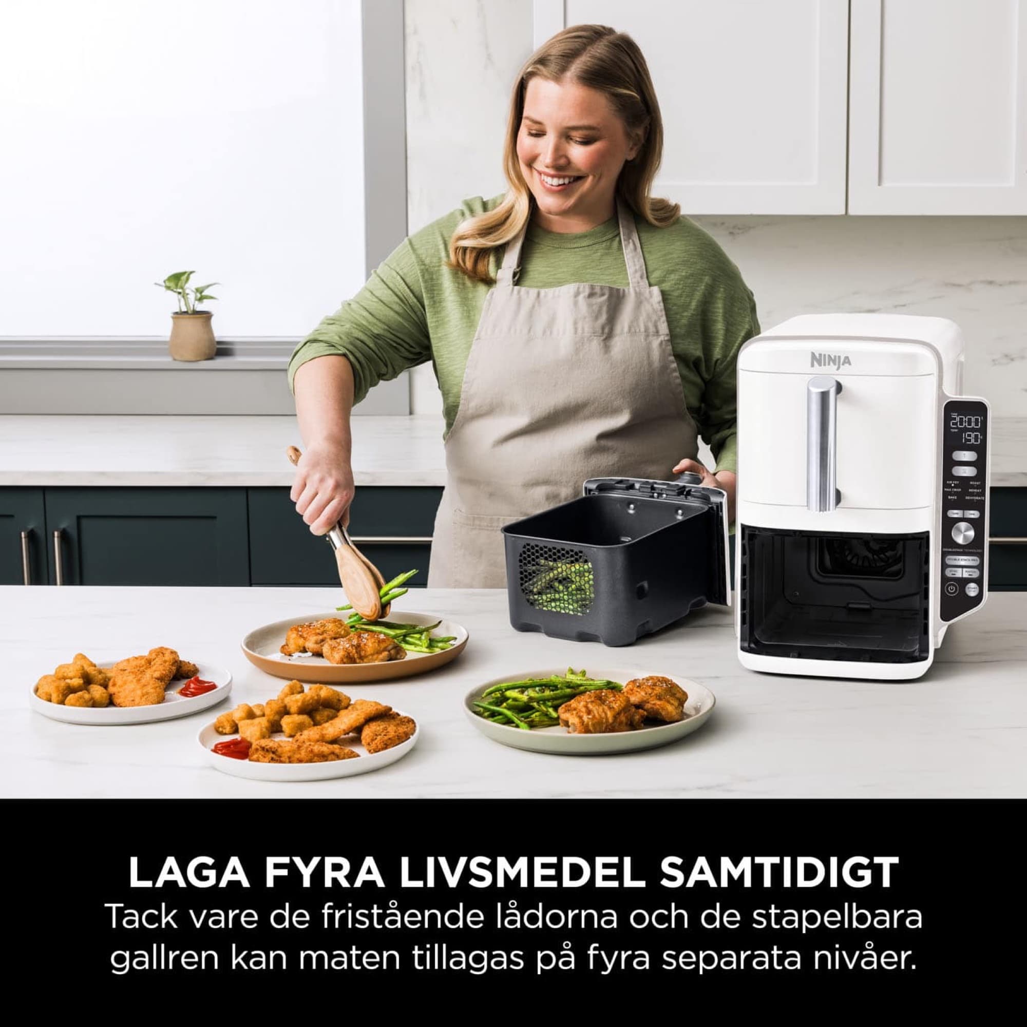 Kvinna lagar flera rätter samtidigt med airfryern